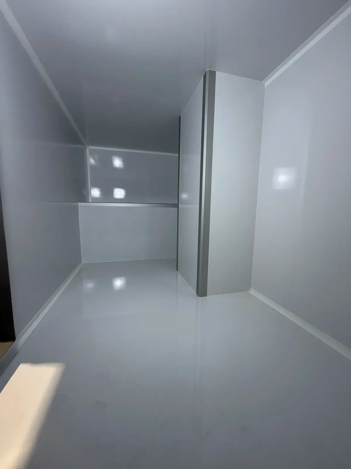 Inside the bright composite body looking toward the rear entry
