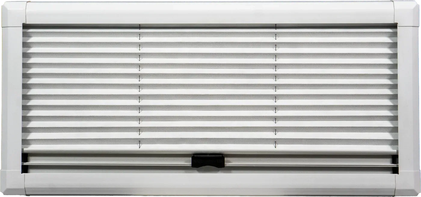 A Foundation Vehicles window with the built-in roller blackout shade pulled down